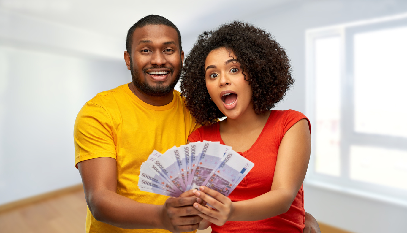 African American Couple with Money at New Home